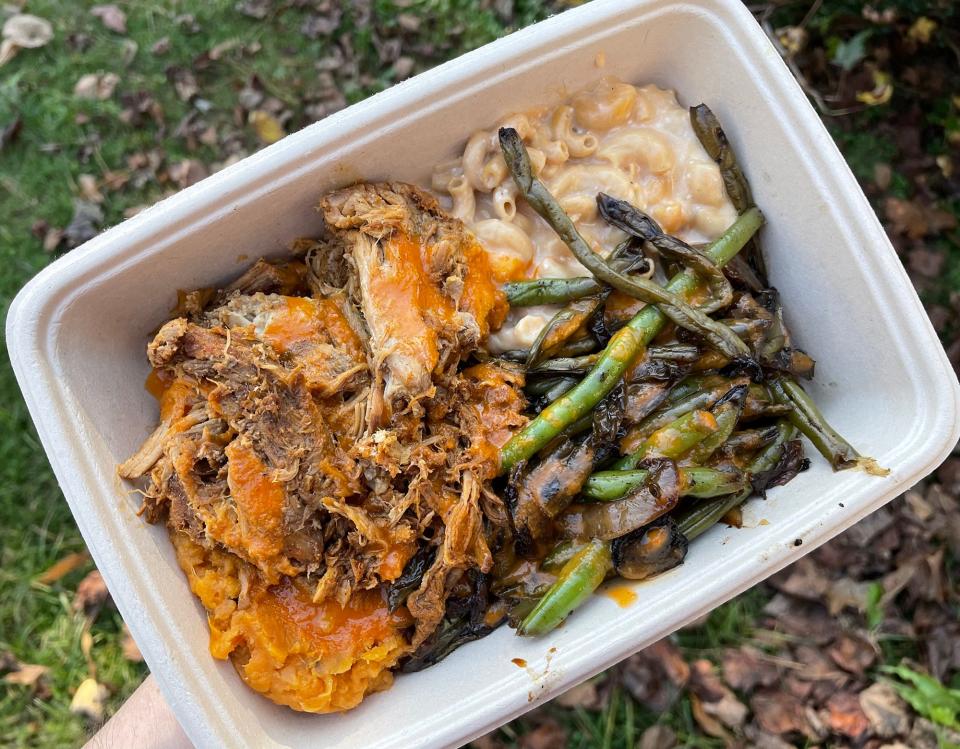 "The Boxcar" plate at Maepole restaurant in Athens, Ga. features sweet potatoes, pork, mac & cheese and green beans topped with a sriracha vinaigrette.