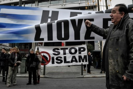 An anti-migrant rally in Athens where a journalist was attacked