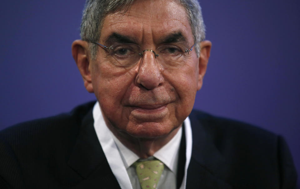 FILE - In this Nov. 13, 2015 file photo, Nobel Peace Prize laureate and two-time Costa Rican President Oscar Arias looks at the media during the opening ceremony of the XV World Summit of Nobel Peace Laureates at the University in Barcelona, Spain. The director of an international center at the University of Nevada in Reno is the latest woman to accuse Arias of sexual misconduct. Carina Black said in an interview that Arias boxed her against a wall inside an elevator in 1998 and then tried to kiss her. She said it happened after she spent a day escorting Arias to meetings and an evening speaking engagement at the university. (AP Photo/Manu Fernandez, File)