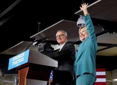 Democratic U.S. presidential nominee Hillary Clinton waves after being introduced by Senate Minority Leader Harry Reid (D-NV) during a rally at the International Brotherhood of Electrical Workers (IBEW), Local 357, union hall in Las Vegas, Nevada, U.S. Thursday, August 4, 2016. REUTERS/Steve Marcus