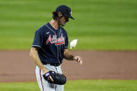 Atlanta Braves starting pitcher Cole Hamels uses a rosin bag before pitching to the Baltimore Orioles during the first inning of a baseball game, Wednesday, Sept. 16, 2020, in Baltimore. (AP Photo/Julio Cortez)