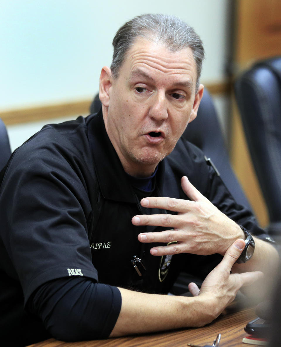 In this Feb. 20, 2019 photo, County Coroner Nick Pappas talks with a reporter at city hall in Waynesville, Mo. Posting press releases to official Facebook pages isn’t quite the same. Pappas said readers are more suspicious of news releases than they would be of a fully reported news story. (AP Photo/Orlin Wagner)