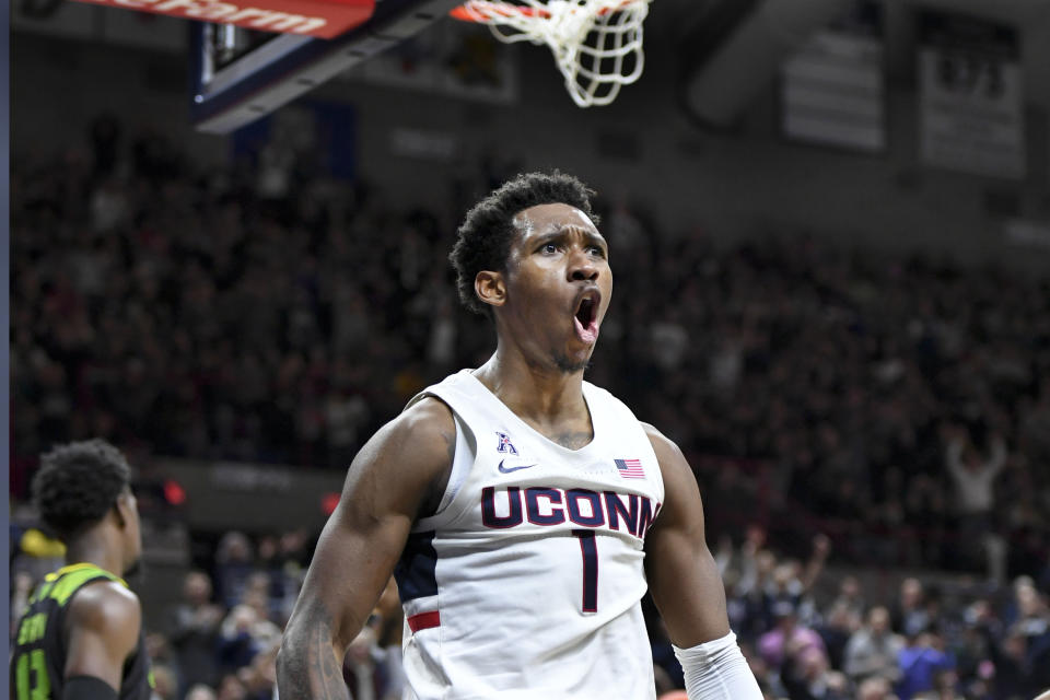 Connecticut's Christian Vital (1) screams after scoring during the second half of an NCAA college basketball game against South Florida, Sunday, Feb. 23, 2020, in Storrs, Conn. (AP Photo/Stephen Dunn)