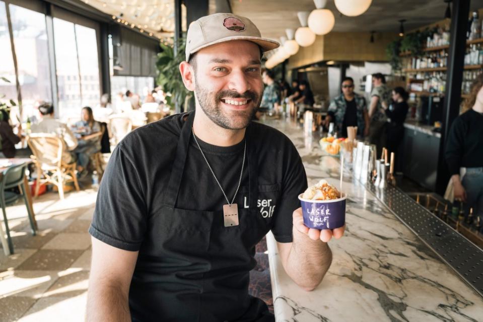 The paper cup of soft serve, held here by Shaul Armony at Laser Wolf, is a playful addition to a fanciful restaurant menu. Stefano Giovannini for N.Y.Post