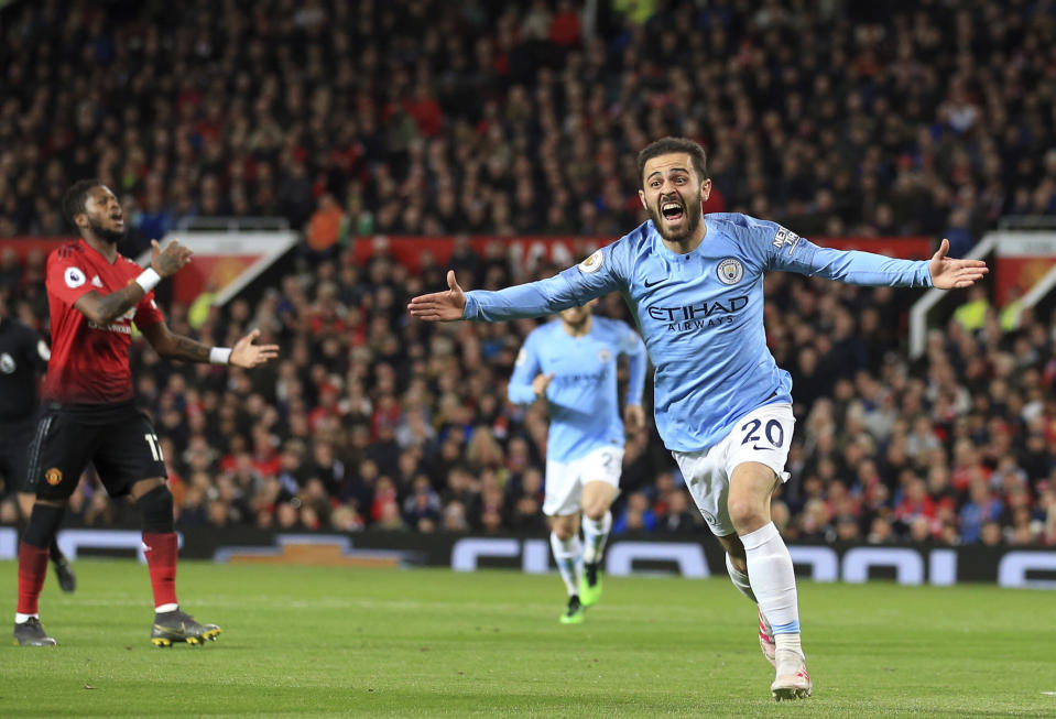 Manchester City's Bernardo Silva celebrates after scoring the opening goal during the English Premier League soccer match between Manchester United and Manchester City at Old Trafford Stadium in Manchester, England, Wednesday April 24, 2019. (AP Photo/Jon Super)