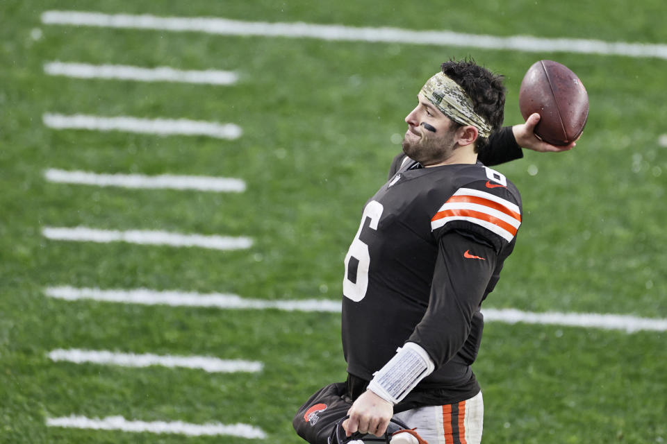 Cleveland Browns quarterback Baker Mayfield throws the game ball to a fan in the stands after the Browns defeated the Philadelphia Eagles in an NFL football game, Sunday, Nov. 22, 2020, in Cleveland. (AP Photo/Ron Schwane)