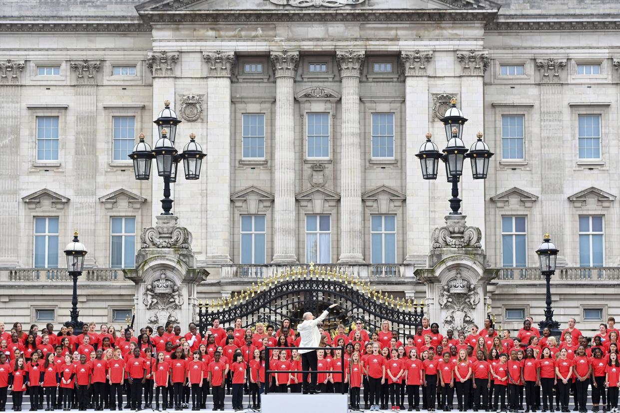 A choir of young children performs during the Platinum Jubilee Pageant in front of Buckingham Palace in London on Sunday, June 5, 2022.