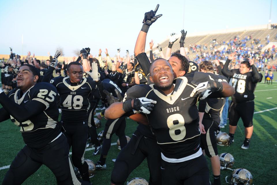 Rider's Domanic Thrasher (8) reacts after the Raiders defeated Frenship during the Region I-4A Finals at Memorial Stadium on Dec. 8, 2012.