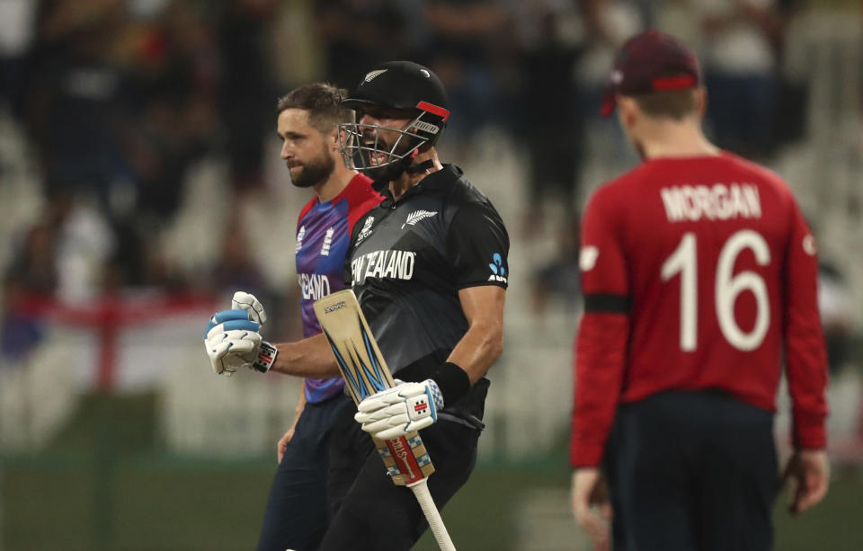 New Zealand's batsman Daryl Mitchell celebrates after winning the Cricket Twenty20 World Cup semi-final match against England in Abu Dhabi, UAE, Wednesday, Nov. 10, 2021. New Zealand beat England by 5 wickets with 6 balls remaining. (AP Photo/Kamran Jebreili)