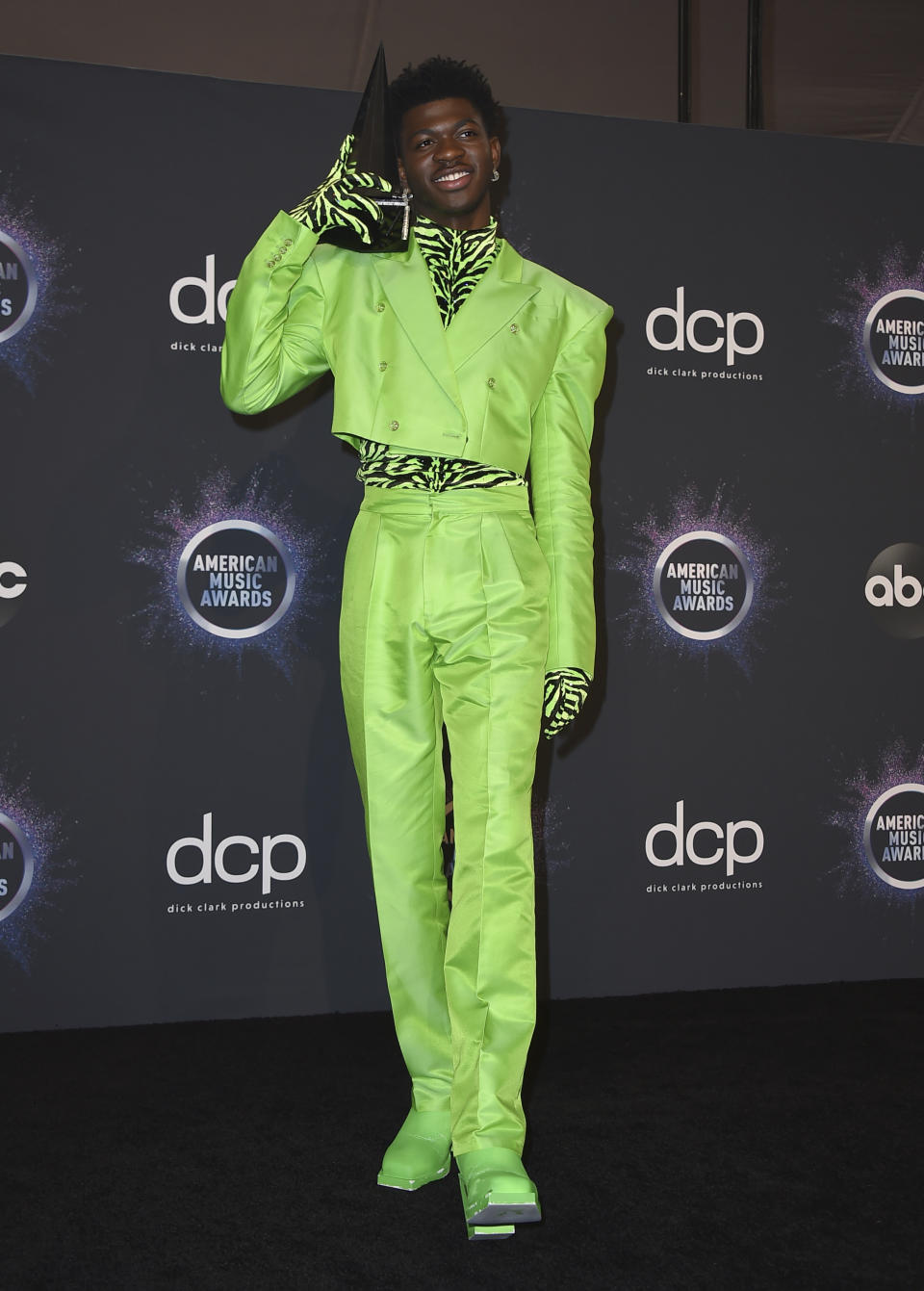 Lil Nas X poses in the press room with the award for favorite rap/hip-hop song for "Old Town Road" at the American Music Awards on Sunday, Nov. 24, 2019, at the Microsoft Theater in Los Angeles. (Photo by Jordan Strauss/Invision/AP)