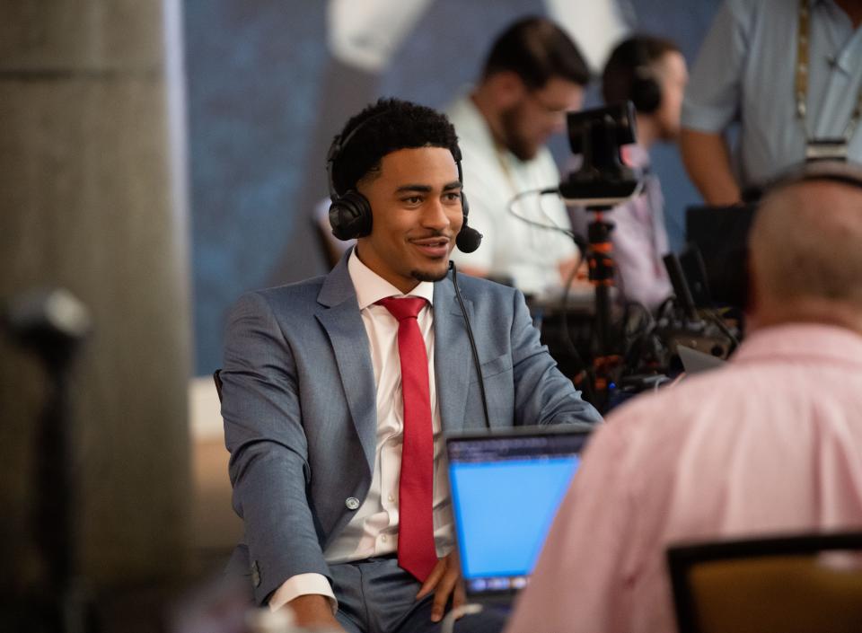 Alabama quarterback Bryce Young is interviewed on radio row during SEC Media Days at the College Football Hall of Fame in Atlanta Tuesday, July 19, 2022.