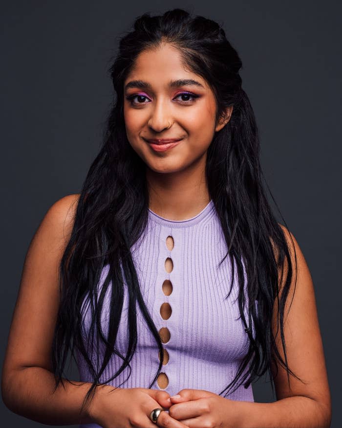 Close-up of Maitreyi Ramakrishnan smiling and wearing a sleeveless knit top