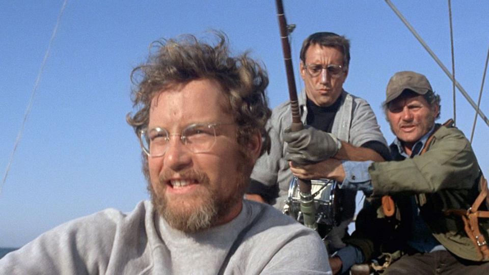 brody and hooper go shark hunting in a scene from 'jaws,' a good housekeeping pick for best scary movies for kids