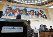 The Transportation Security Administration (TSA) administrator David P. Pekoske, center, talks during a news conference in Los Angeles' Union Station on Tuesday, Aug. 14, 2018. Pekoske talked about the ThruVision suicide vest-detection technology that reveals suspicious objects on people. Aiming to stay ahead of an evolving threat against transit systems worldwide, officials in Los Angeles are testing out the airport-style body scanners that screen subway passengers for firearms and explosives. (AP Photo/Richard Vogel)