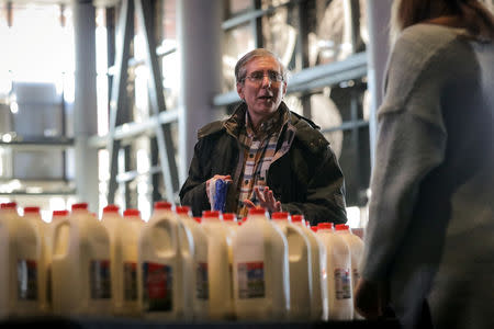 A government employee receives donations at a food distribution center for federal workers impacted by the government shutdown, at the Barclays Center in the Brooklyn borough of New York, U.S., January 22, 2019. REUTERS/Brendan McDermid