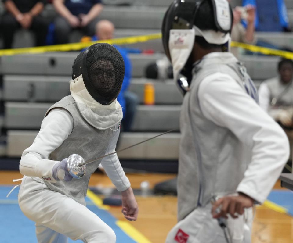 Randolph, NJ -- January 13, 2024 -- Declan Webster of Mendham and Aaryan Shah of Morris Hills compete at the Morris County Fencing Tournament held at Randolph.