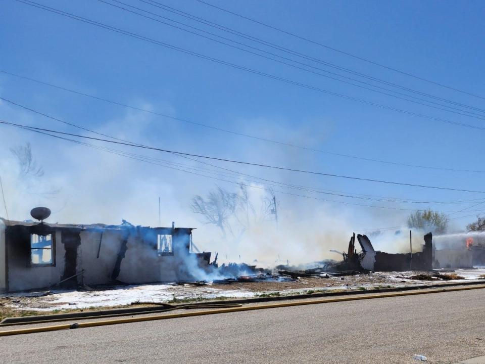 Amarillo firefighters battle a fire involving two structures near NW 3rd and N Jefferson near downtown Amarillo on Friday afternoon.