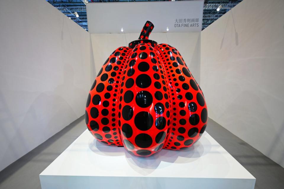 SHANGHAI, CHINA - NOVEMBER 05: The 'Pumpkin' sculpture by Japanese artist Yayoi Kusama is on display at the booth of Ota Fine Arts during the 4th China International Import Expo (CIIE) at the National Exhibition and Convention Center (Shanghai) on November 5, 2021 in Shanghai, China. (Photo by Shen Chunchen/VCG via Getty Images)