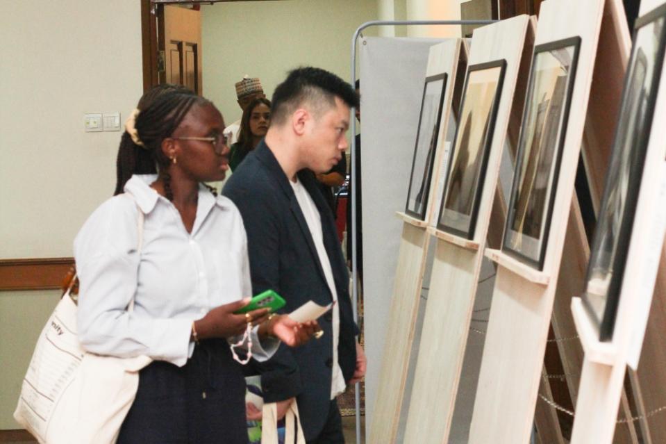 Visitors look at a photo exhibition at the festival, held in the Kuala Lumpur Selangor Chinese Assembly Hall from 10am to 11pm until Sunday. — Picture courtesy of Amnesty International Malaysia 