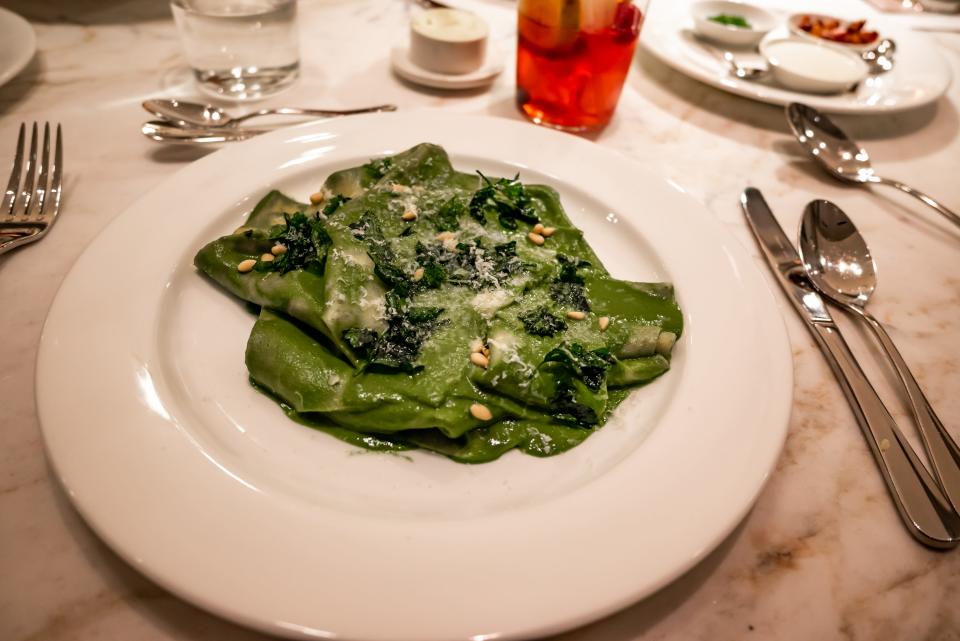 green pasta on plate