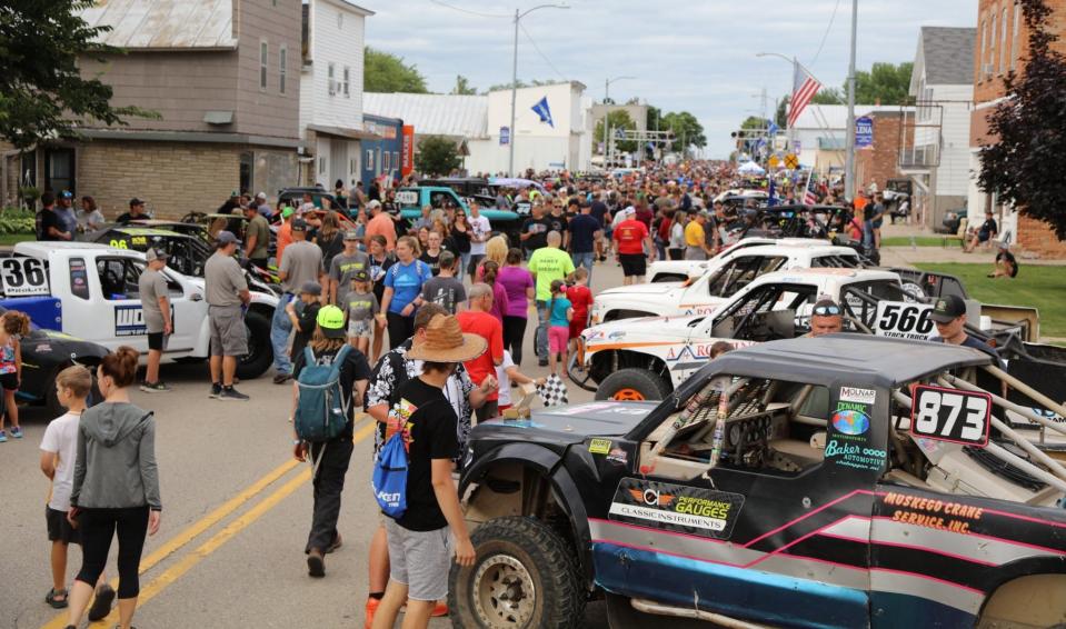 Fans line the street in down Lena for 2022's "Thunder on Main," a parade and show of off-road racing vehicles competing in the Dirt City Off-Road Nationals in Lena. This year's downtown show takes place the evening of July 28, with the AMSOIL Championship Off-Road Series racing at the Dirt City Motorplex in Lena on July 29 and 30.