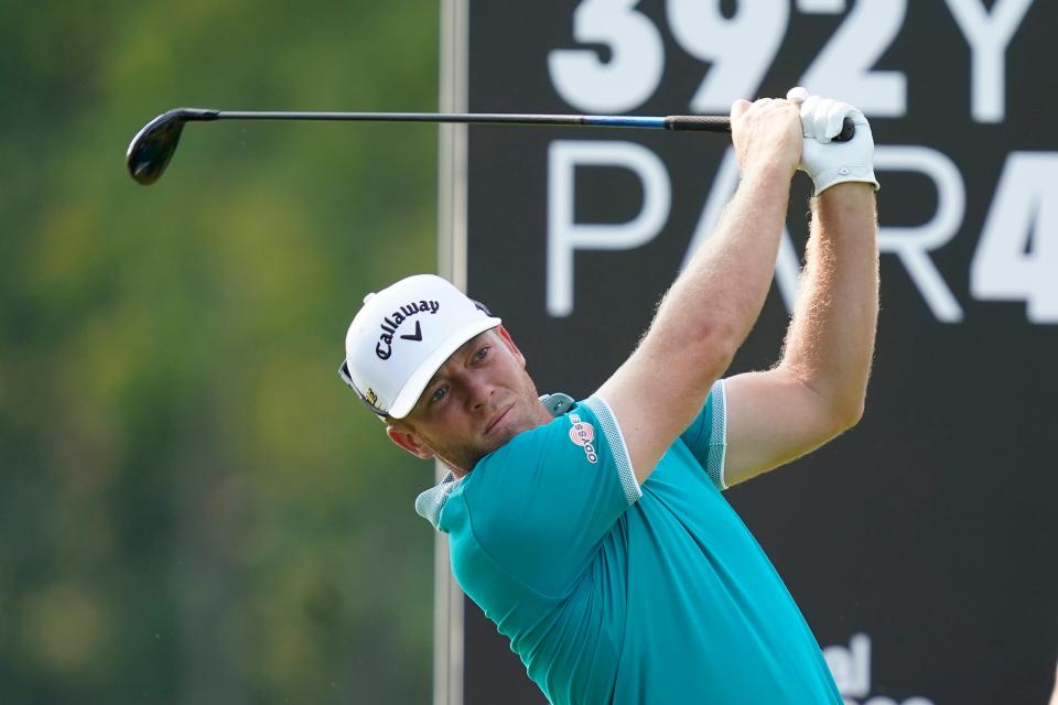 Talor Gooch watches his tee shot on the 12th hole during the first round of the LIV Golf Invitational-Chicago tournament Friday, Sept. 16, 2022, in Sugar Grove, Ill. (AP Photo/Charles Rex Arbogast)