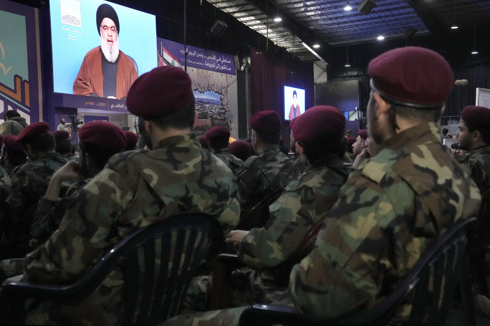 Hezbollah fighters listen to their leader Sayyed Hassan Nasrallah who is speaking via a video link during a rally to mark Jerusalem day, in a southern suburb of Beirut, Lebanon, Friday, April 14, 2023. Since Iran's Islamic Revolution in 1979, the rallies marking what is also known as al-Quds Day have typically been held on the last Friday of the Muslim holy month of Ramadan. (AP Photo/Hussein Malla)