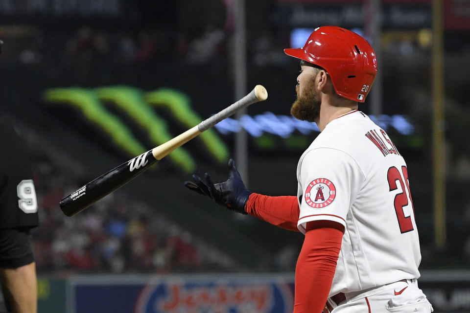Los Angeles Angels' Jared Walsh flips his bat after striking out during the sixth inning of a baseball game against the Seattle Mariners Friday, June 24, 2022, in Anaheim, Calif. (AP Photo/Mark J. Terrill)