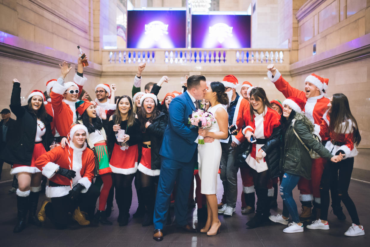 Siew Yen Chai and Alex MacPherson were photobombed by a group of people dressed as Santa Claus. (Photo: Sascha Reinking Photography)