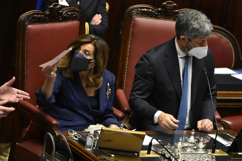 President of the Italian Senate, Maria Elisabetta Alberti Casellati, left, and President of the Italian Lower Chamber Roberto Fico count ballots in the Italian parliament in Rome, Wednesday, Jan. 26, 2022. The first two rounds of voting in Italy's Parliament for the country's next president yielded an avalanche of blank ballots, as lawmakers and special regional electors failed to deliver a winner amid a political stalemate. (Alberto Pizzoli/Pool photo via AP)