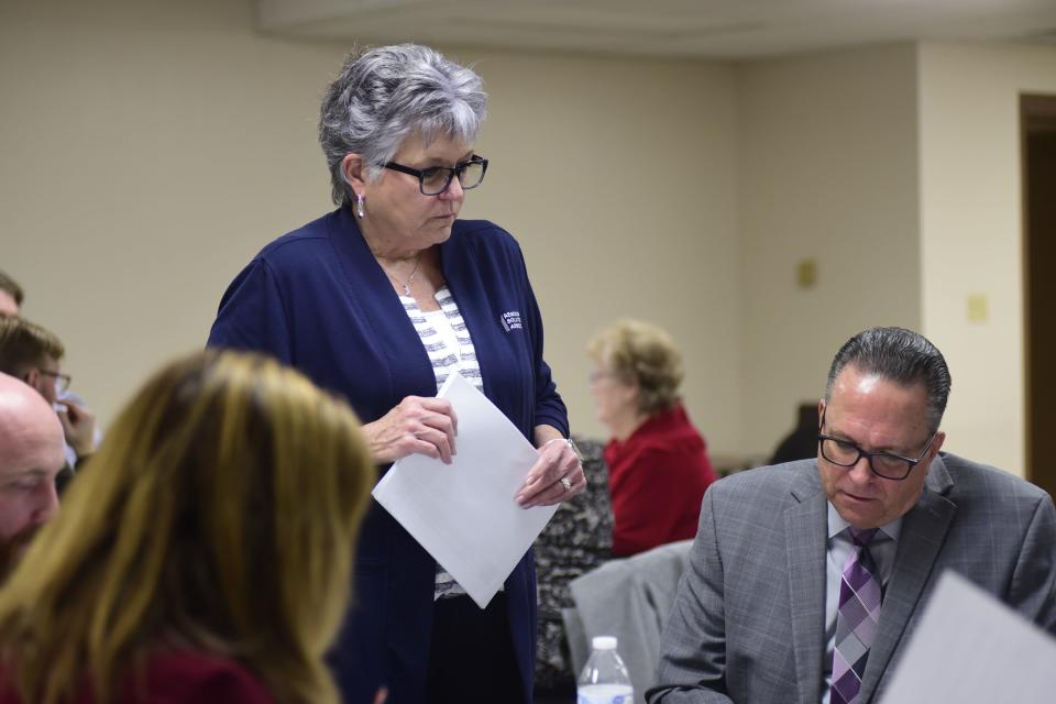 Sandy Hovest, president of Resource Solutions Associates, helps Richland County officials review their hazard mitigation plan.