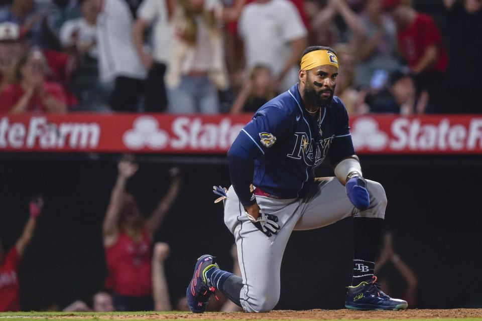 Tampa Bay Rays' Yandy Diaz reacts after being tagged out at home by Los Angeles Angels catcher Logan O'Hoppe to complete a triple play started when Harold Ramirez grounded to short during the ninth inning of a baseball game Friday, Aug. 18, 2023, in Anaheim, Calif. Randy Arozarena was out at second and Ramirez out at first. (AP Photo/Ryan Sun)