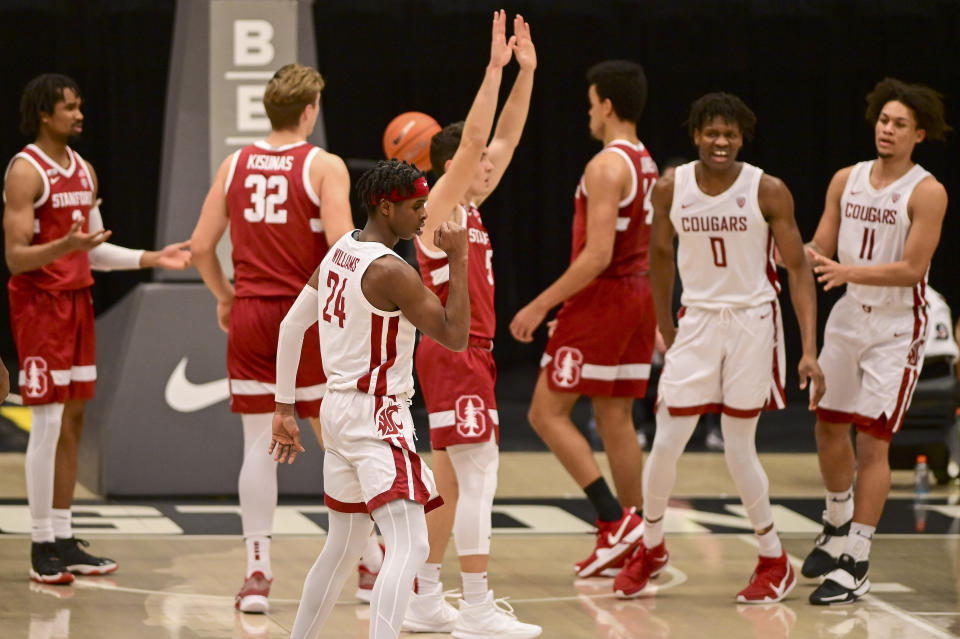 Washington State guard Noah Williams (24) reacts after scoring a basket while being fouled by Stanford guard Michael O'Connell (5) during the first half of an NCAA college basketball game, Saturday, Feb. 20, 2021, in Pullman, Wash. (AP Photo/Pete Caster)