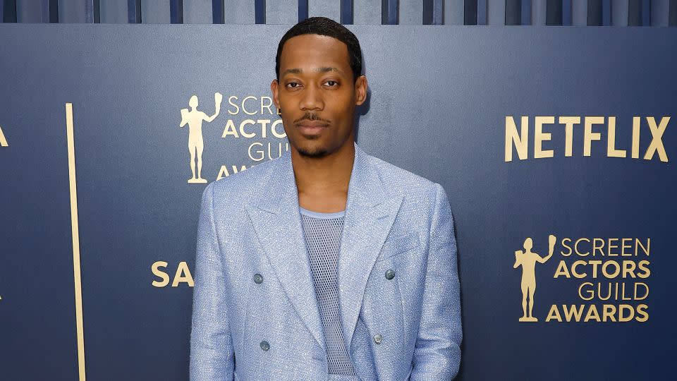 Tyler James Williams in a slouchy Amiri suit and matching mesh vest. - Frazer Harrison/Getty Images