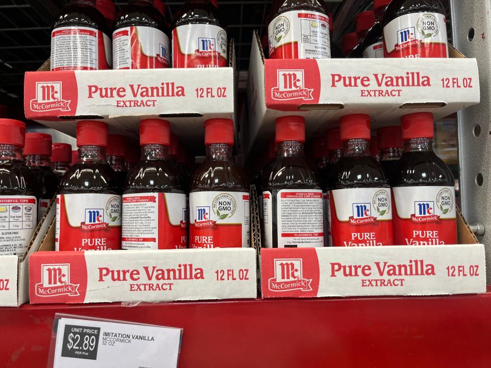 Display of bottles of pure vanilla in cardboard trays at a sam's club