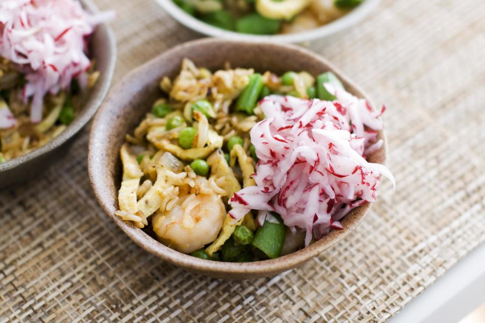 In this image taken on April 8, 2013, shrimp fried rice with pickled radishes is shown served in bowls in Concord, N.H. (AP Photo/Matthew Mead)