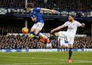 Football Soccer - Everton v Swansea City - Barclays Premier League - Goodison Park - 24/1/16 Everton's Leighton Baines in action with Swansea's Angel Rangel Action Images via Reuters / Jason Cairnduff