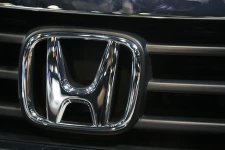 The grill emblem is seen on a Honda Accord during the Chicago Auto Show February 6, 2008. REUTERS/John Gress