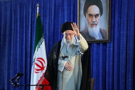 FILE PHOTO: Iran's Supreme Leader Ayatollah Ali Khamenei waves his hand as he arrives to deliver a speech during a ceremony marking the 30th death anniversary of the founder of the Islamic Republic Ayatollah Ruhollah Khomeini in Tehran