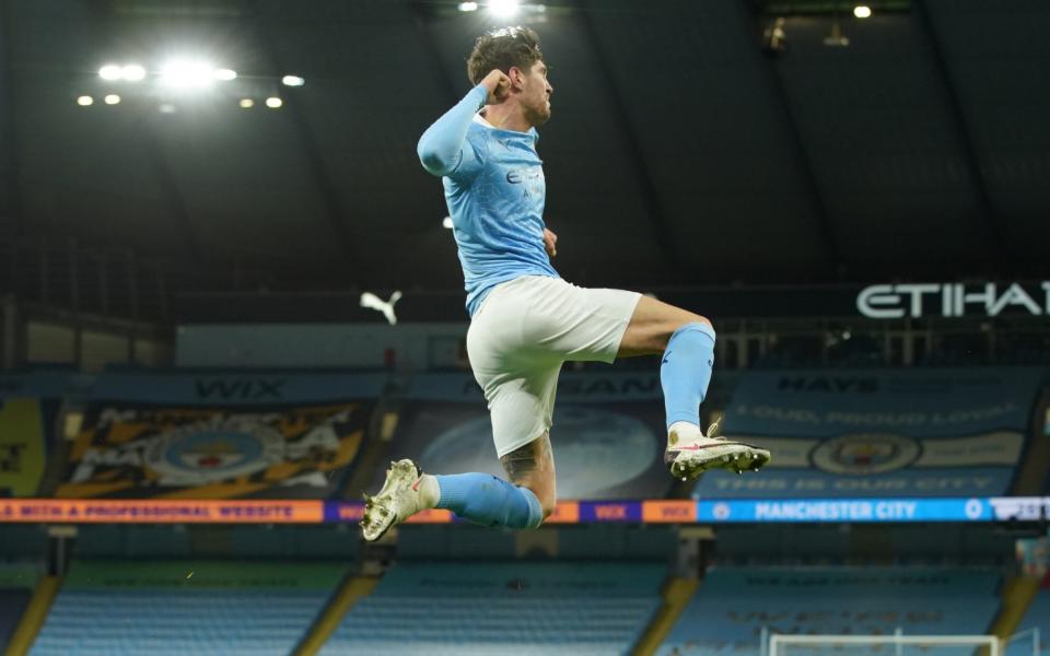 John Stones celebrates after making it 1-0 to Manchester City - NMC POOL