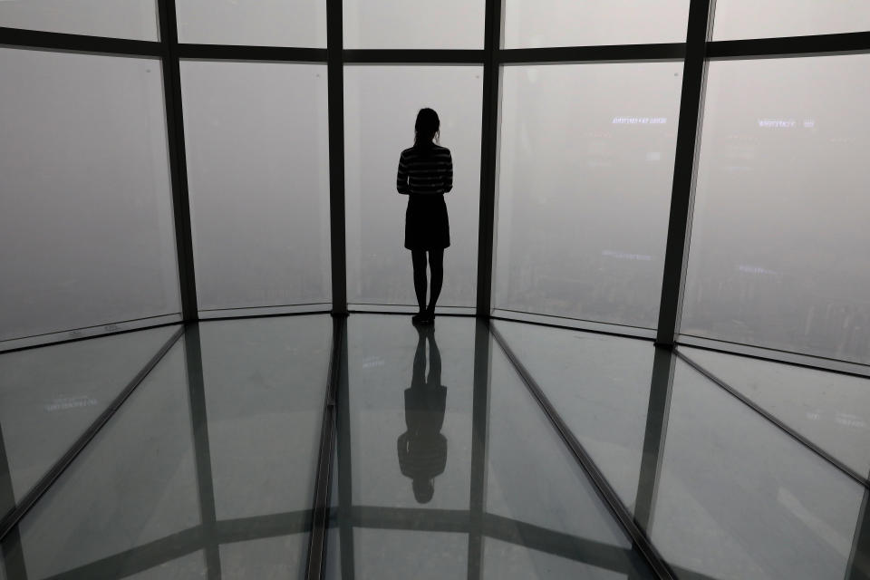 A South Korean woman looks at a view of Seoul city  shrouded by fine dust during a polluted day on March 6, 2019 in Seoul, South Korea. Most of South Korea was blanketed by extraordinarily heavy levels of choking fine dust air pollution for the sixth consecutive day and forecasters say the condition is unlikely to improve for the time being. (Photo: Chung Sung-Jun/Getty Images)