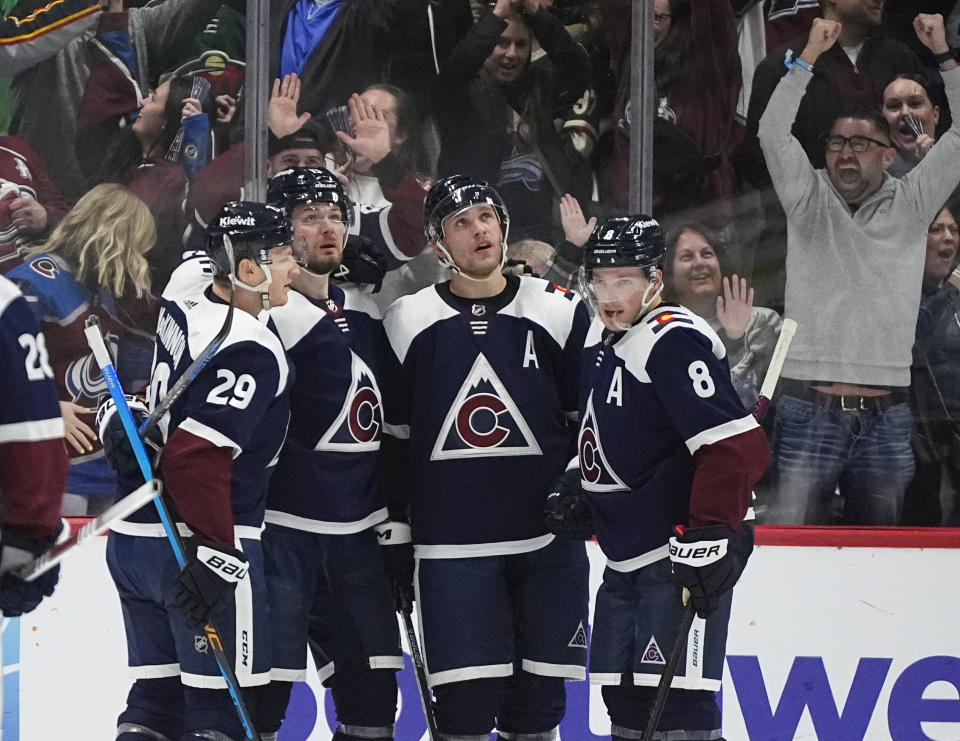 From left, Colorado Avalanche center Nathan MacKinnon, right wing Valeri Nichushkin, right wing Mikko Rantanen and defenseman Cale Makar celebrate after Nichushkin scored the winning goal in overtime of an NHL hockey game against the Minnesota Wild Friday, March 8, 2024, in Denver. (AP Photo/David Zalubowski)