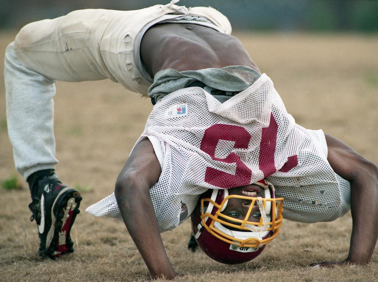 DB Fernando Bryant, Murfreesboro Riverdale High: Here, Bryant stretch out at the start of practice at the school Dec. 7, 1994 for their upcoming TSSAA Class 5A state championship game against Germantown High.