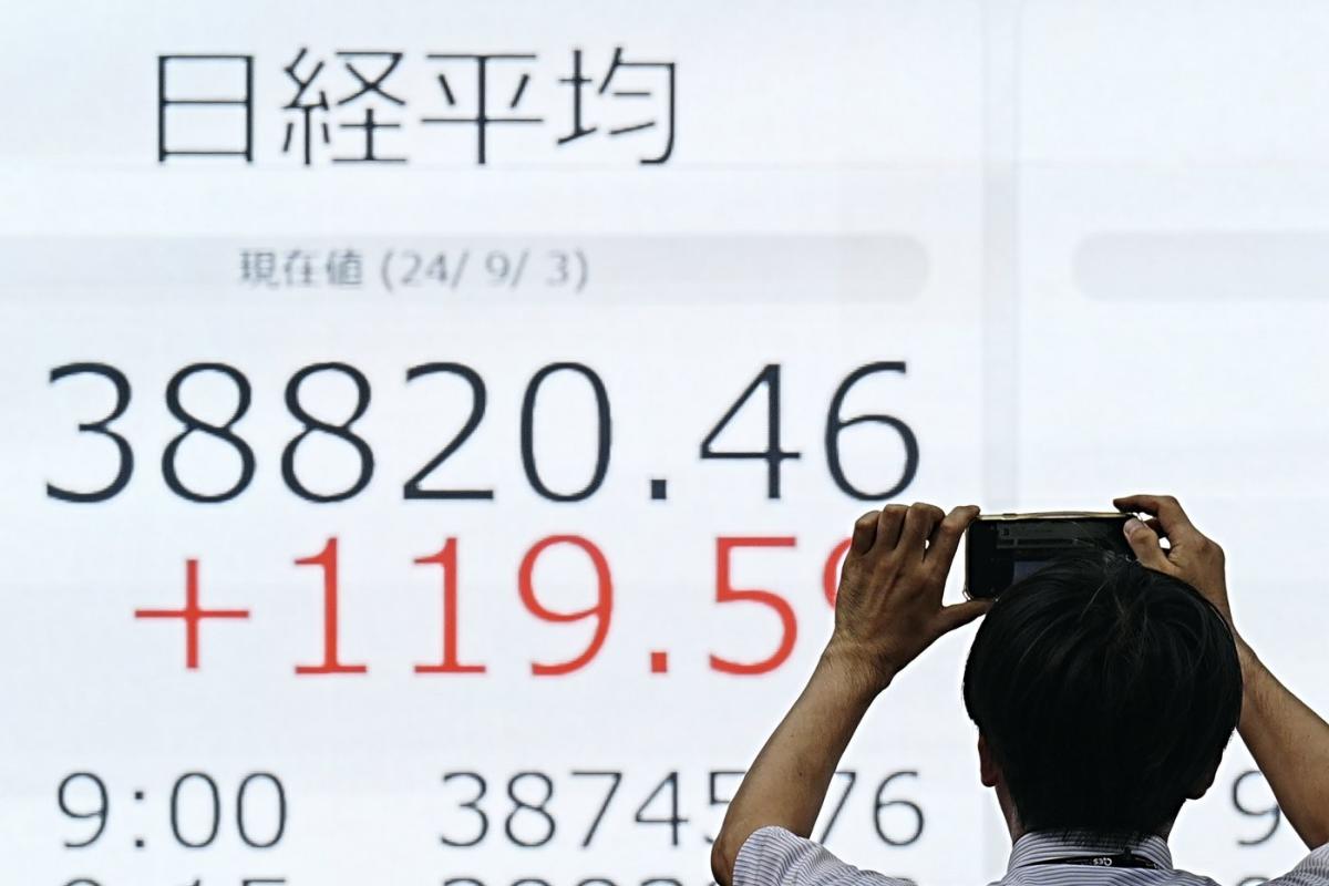 Global shares trade mostly lower as investors wait for key US jobs report