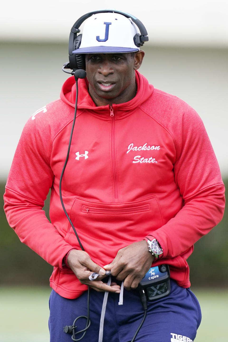 Jackson State football coach Deion Sanders calls out to his players during the first half of an NCAA college football against Edward Waters in Jackson, Miss., Sunday, Feb. 21, 2021. The game marks Sanders's collegiate head coaching debut. (AP Photo/Rogelio V. Solis)