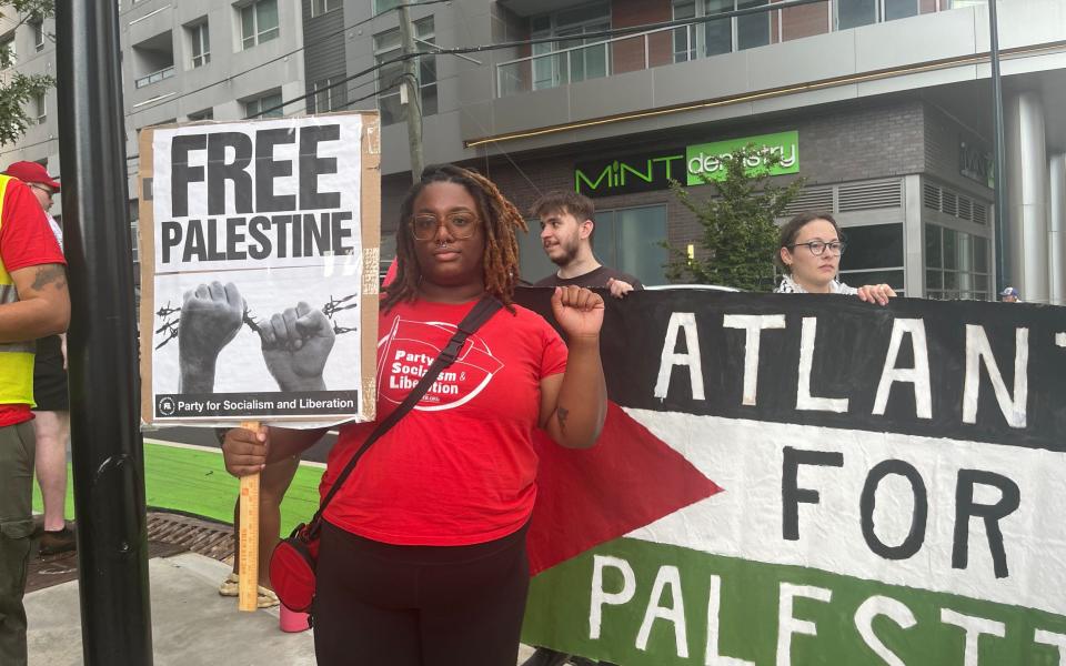 Monica Johnson, 25, protests outside the first presidential debate in Atlanta, Georgia