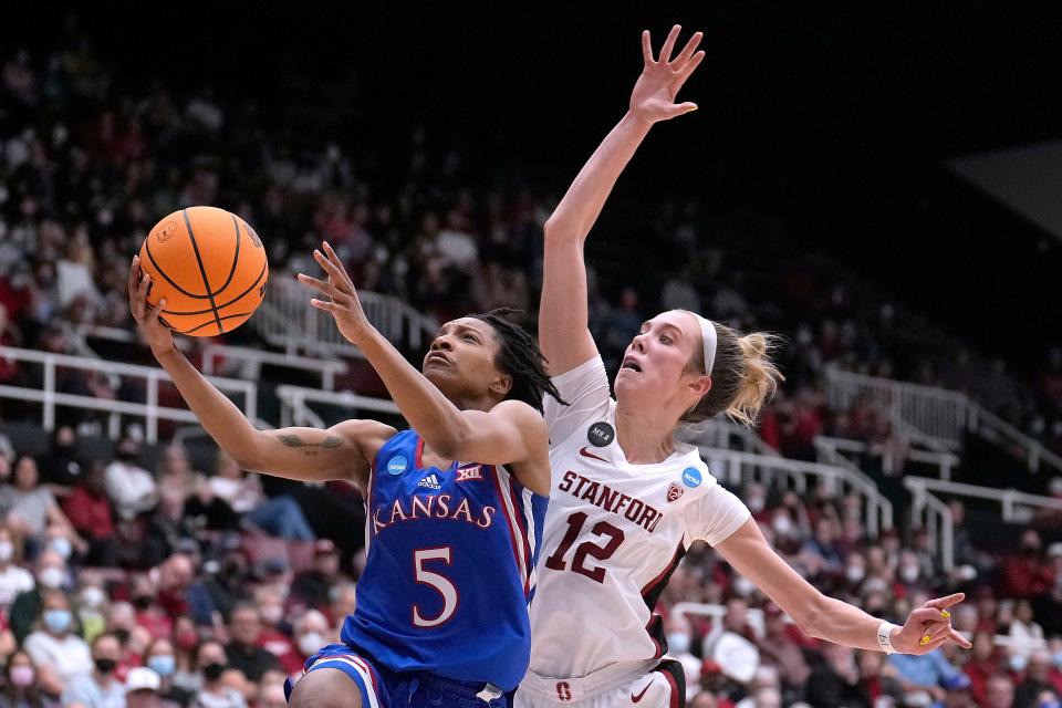 Kansas guard Aniya Thomas (5) drives to the basket against Stanford guard Lexie Hull (12) during the second half of a second-round game in the NCAA women's college basketball tournament Sunday, March 20, 2022, in Stanford, Calif. (AP Photo/Tony Avelar)