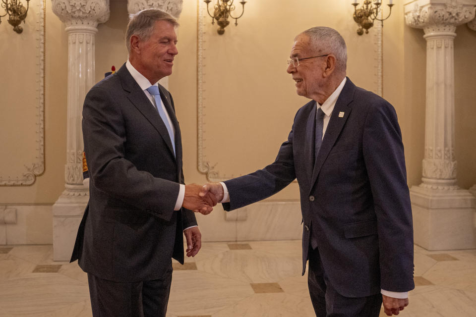 Austria's President Alexander Van der Bellen, right, shakes hands with Romania's President Klaus Iohannis, left, at the Cotroceni Presidential Palace in Bucharest, Romania, Wednesday, Sept. 6, 2023. Romania hosts the two-day Three Seas Initiative Summit and Business Forum, bringing together high ranking officials from twelve EU member states between the Baltic, Black and Adriatic seas. (AP Photo/Vadim Ghirda)