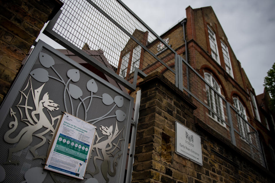 LONDON, ENGLAND - MAY 17: A sign on an entrance gate indicates advice on coronavirus at schools at the temporarily closed Galleywall Primary School on May 17, 2020 in London, England. The government has said schools in England can reopen as early as June 1, but teachers' unions have expressed concerns it is unsafe. Meanwhile, schools in Wales, Scotland and Northern Ireland may not restart before the summer holidays. (Photo by Chris J Ratcliffe/Getty Images)