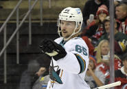 San Jose Sharks defenseman Erik Karlsson (65) reacts after scoring a goal during the second period of an NHL hockey game against the New Jersey Devils Tuesday, Nov. 30, 2021, in Newark, N.J. (AP Photo/Bill Kostroun)